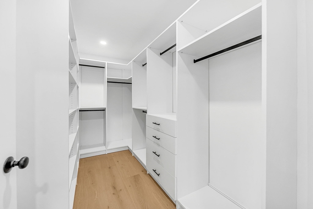 57 Raymond Street, Unit 2 Franklin, MA 02038 - Photo 24 of 41 a view of walk in closet with white walls