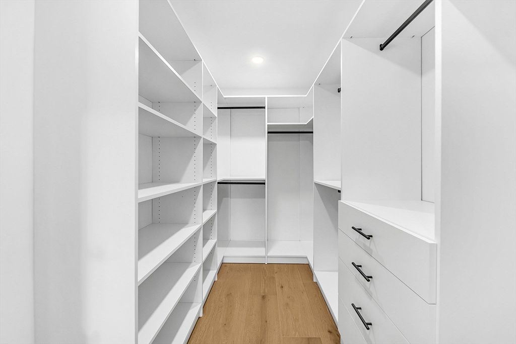 57 Raymond Street, Unit 2 Franklin, MA 02038 - Photo 25 of 41 a view of walk in closet with empty racks