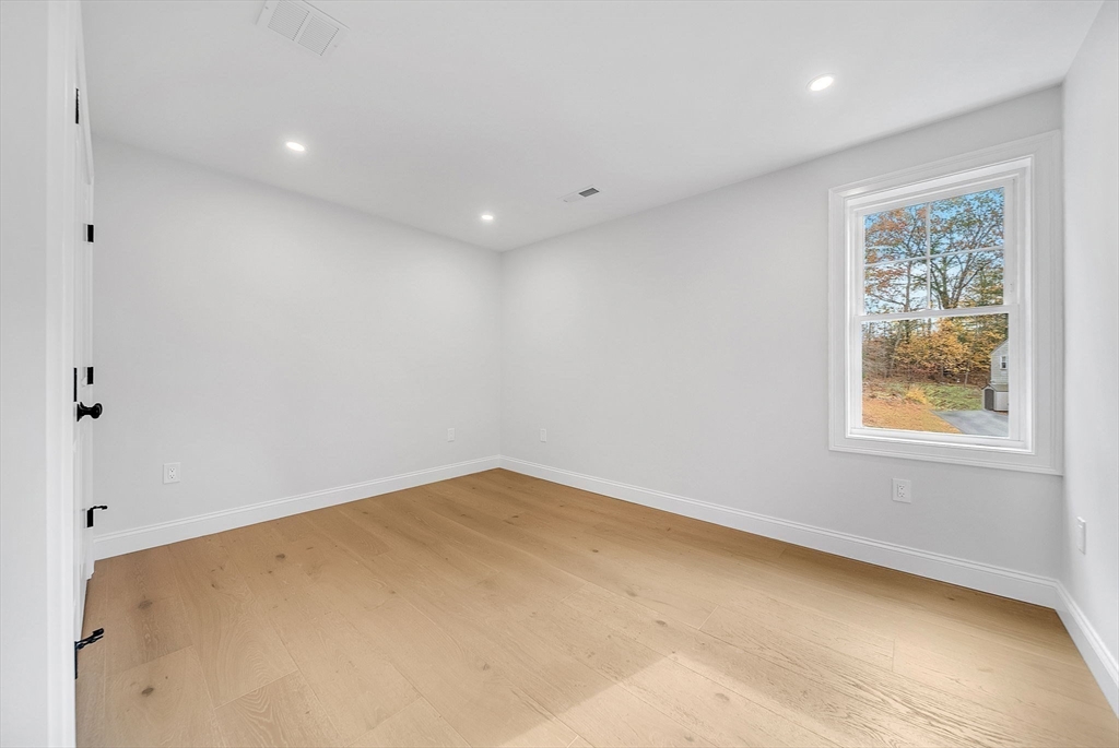 57 Raymond Street, Unit 2 Franklin, MA 02038 - Photo 29 of 41 an empty room with windows