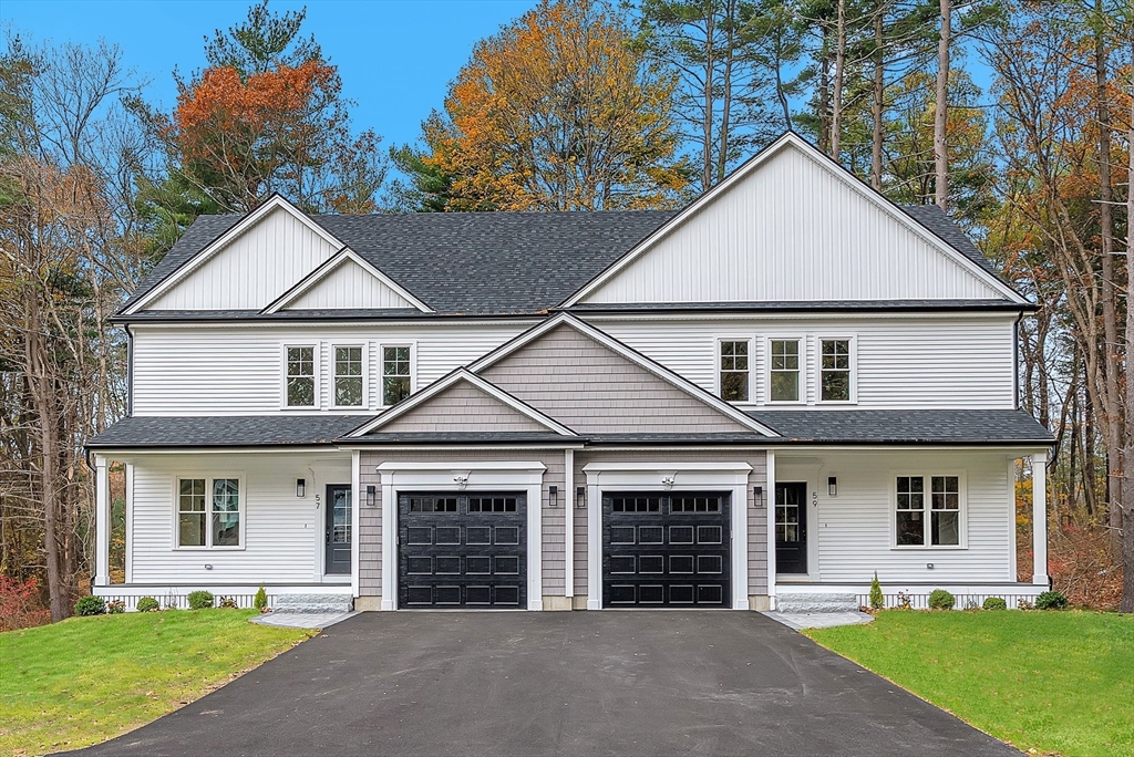 57 Raymond Street, Unit 2 Franklin, MA 02038 - Photo 3 of 41 front view of a house with a yard
