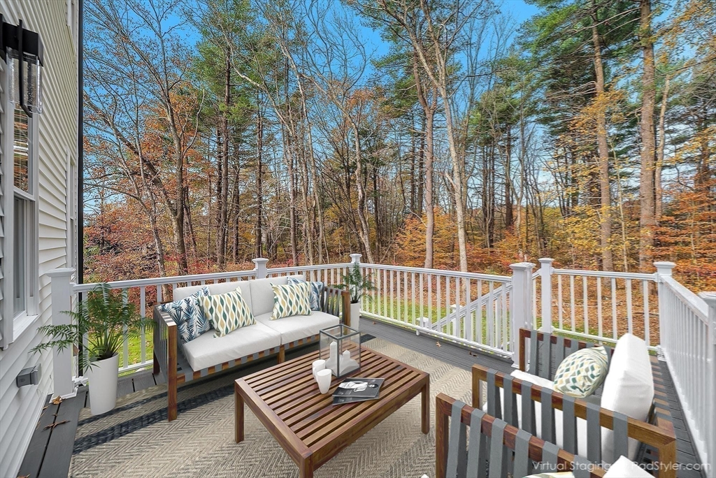 57 Raymond Street, Unit 2 Franklin, MA 02038 - Photo 33 of 41 a view of a patio with a couch