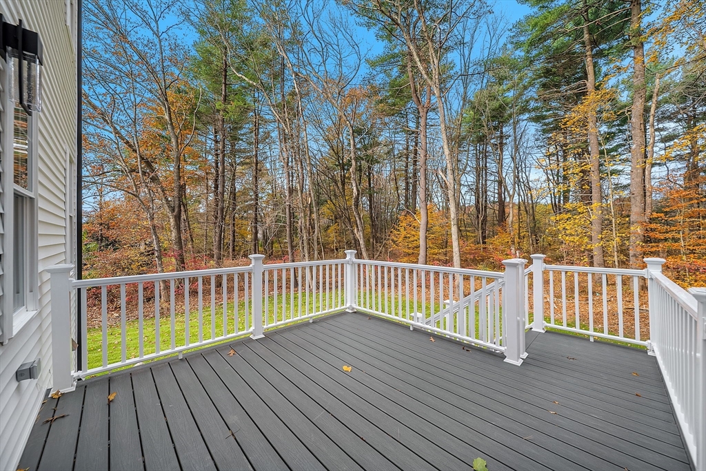 57 Raymond Street, Unit 2 Franklin, MA 02038 - Photo 34 of 41 a view of a wooden deck
