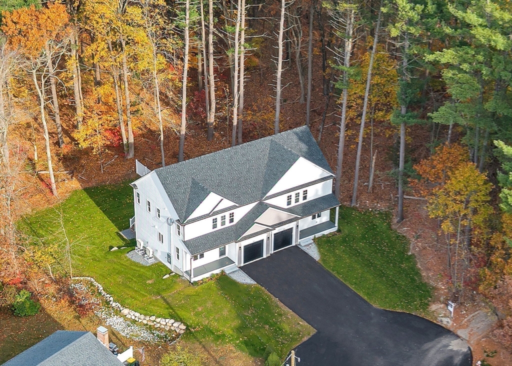 57 Raymond Street, Unit 2 Franklin, MA 02038 - Photo 38 of 41 an aerial view of a house with a yard