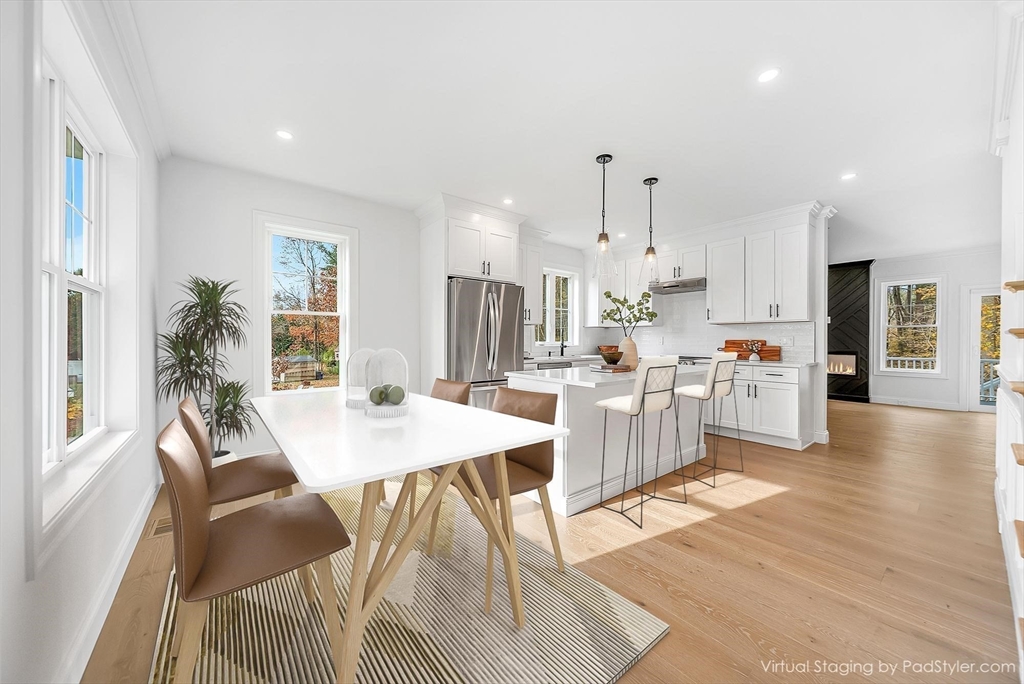 57 Raymond Street, Unit 2 Franklin, MA 02038 - Photo 4 of 41 a large kitchen with cabinets table and chairs