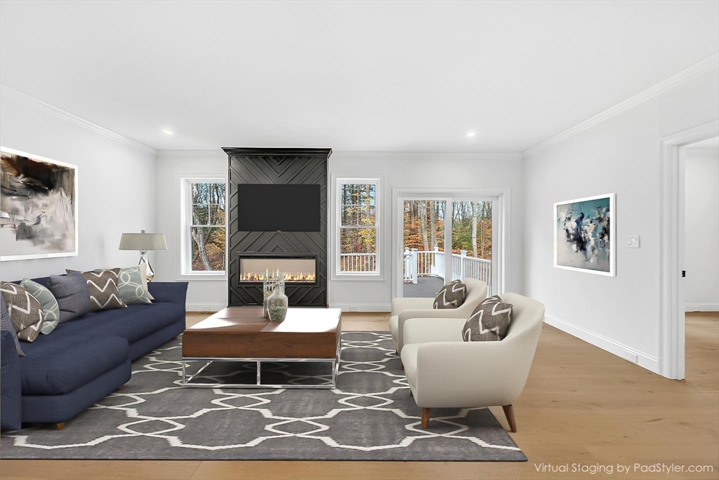 57 Raymond Street, Unit 2 Franklin, MA 02038 - Photo 8 of 41 a living room with furniture a lamp a rug and a large window
