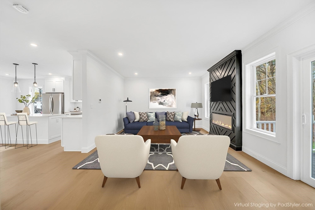 57 Raymond Street, Unit 2 Franklin, MA 02038 - Photo 10 of 41 a living room with furniture and a large window