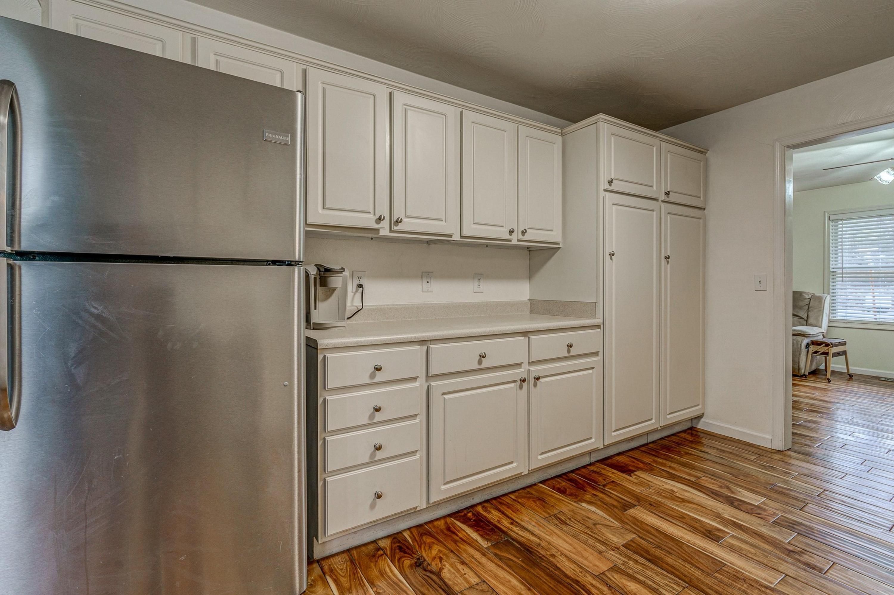 6071 Goodview Road Goodview, VA 24095 - Photo 15 of 44 a kitchen with white cabinets and refrigerator
