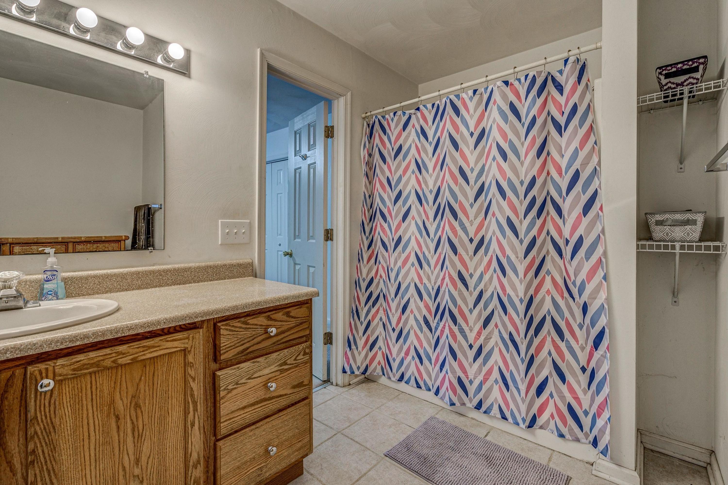 6071 Goodview Road Goodview, VA 24095 - Photo 22 of 44 a bathroom with a sink and a mirror
