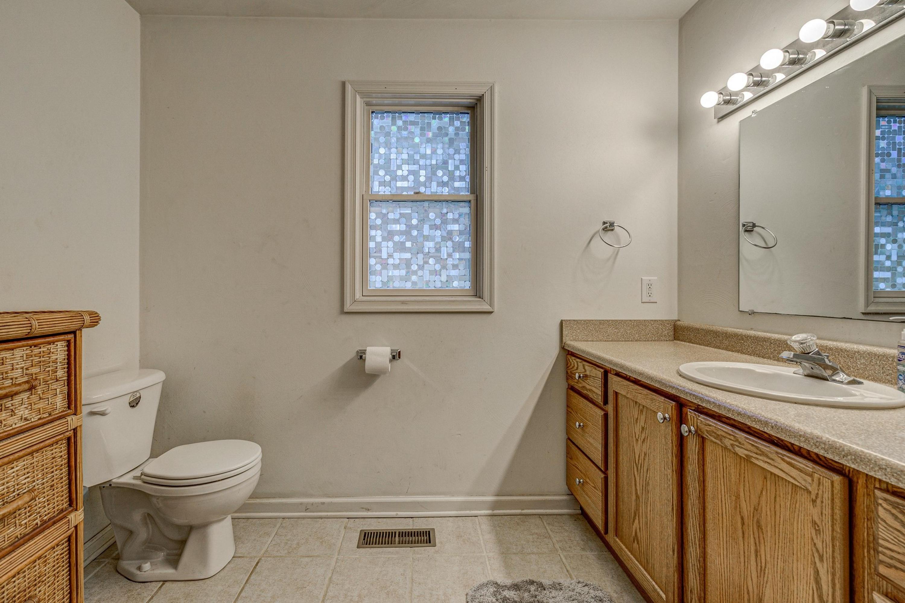 6071 Goodview Road Goodview, VA 24095 - Photo 23 of 44 a bathroom with a sink a toilet and shower