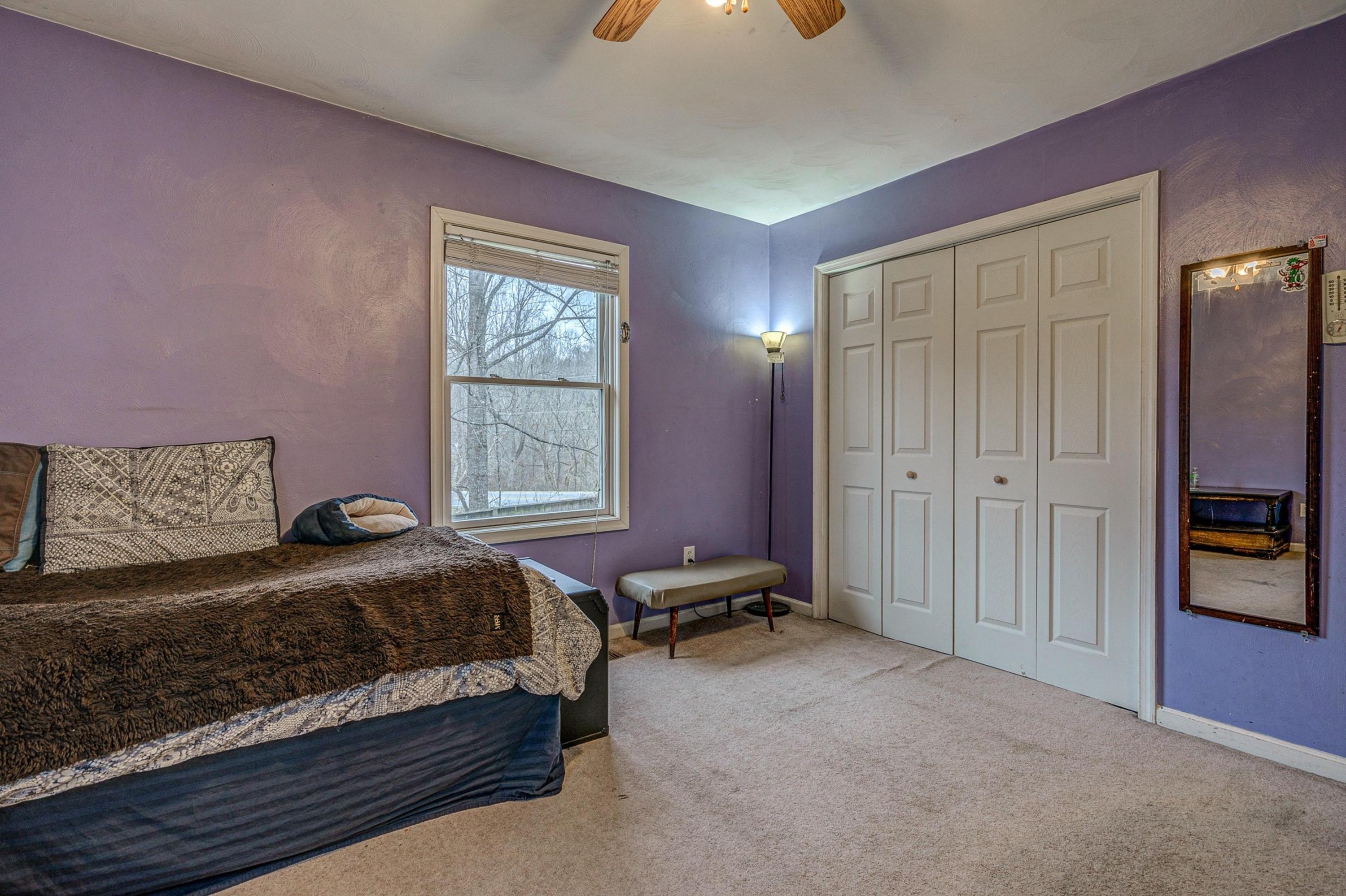 6071 Goodview Road Goodview, VA 24095 - Photo 25 of 44 a bedroom with a bed and a cabinets