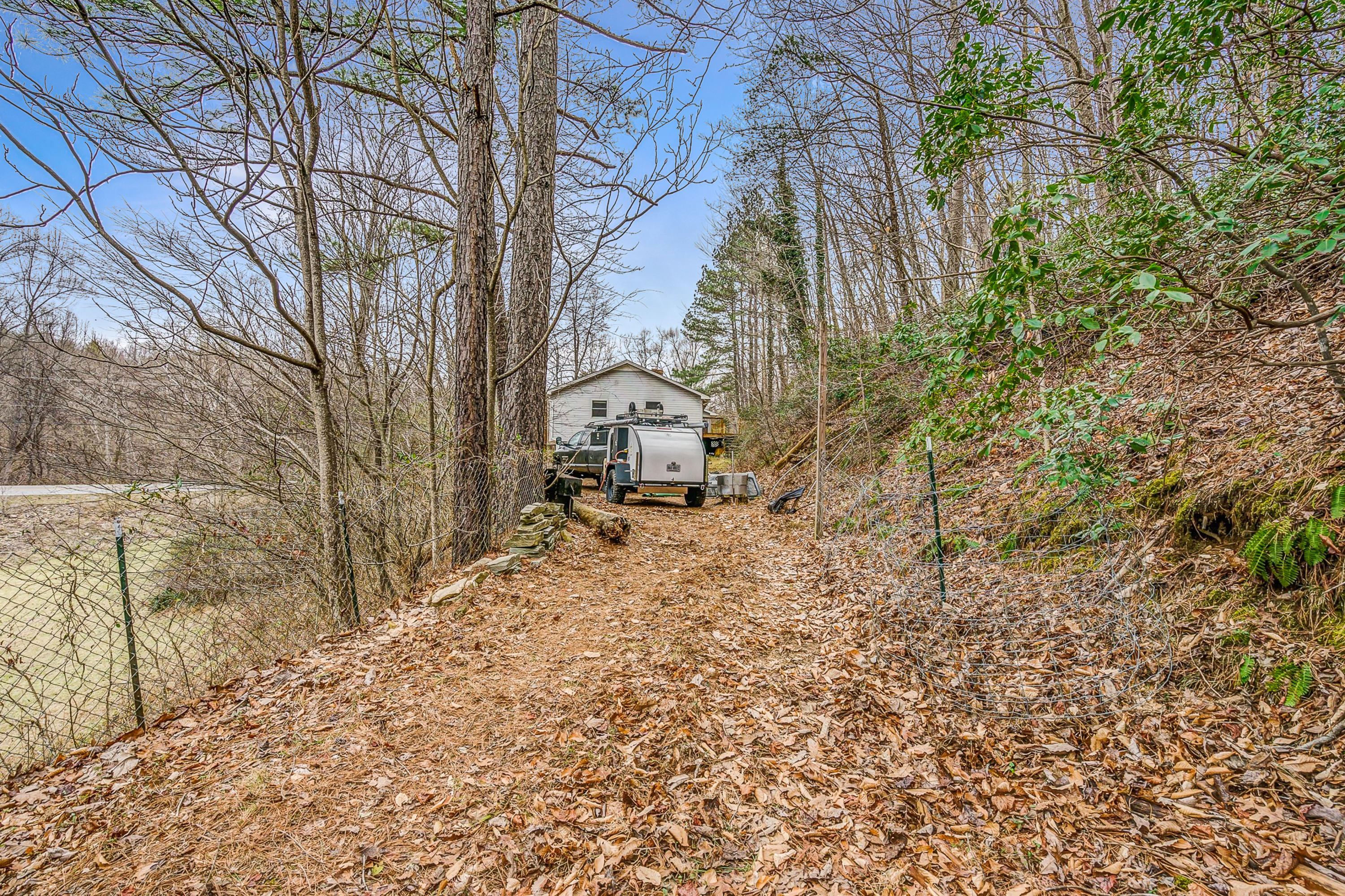 6071 Goodview Road Goodview, VA 24095 - Photo 35 of 44 a view of a backyard with large trees