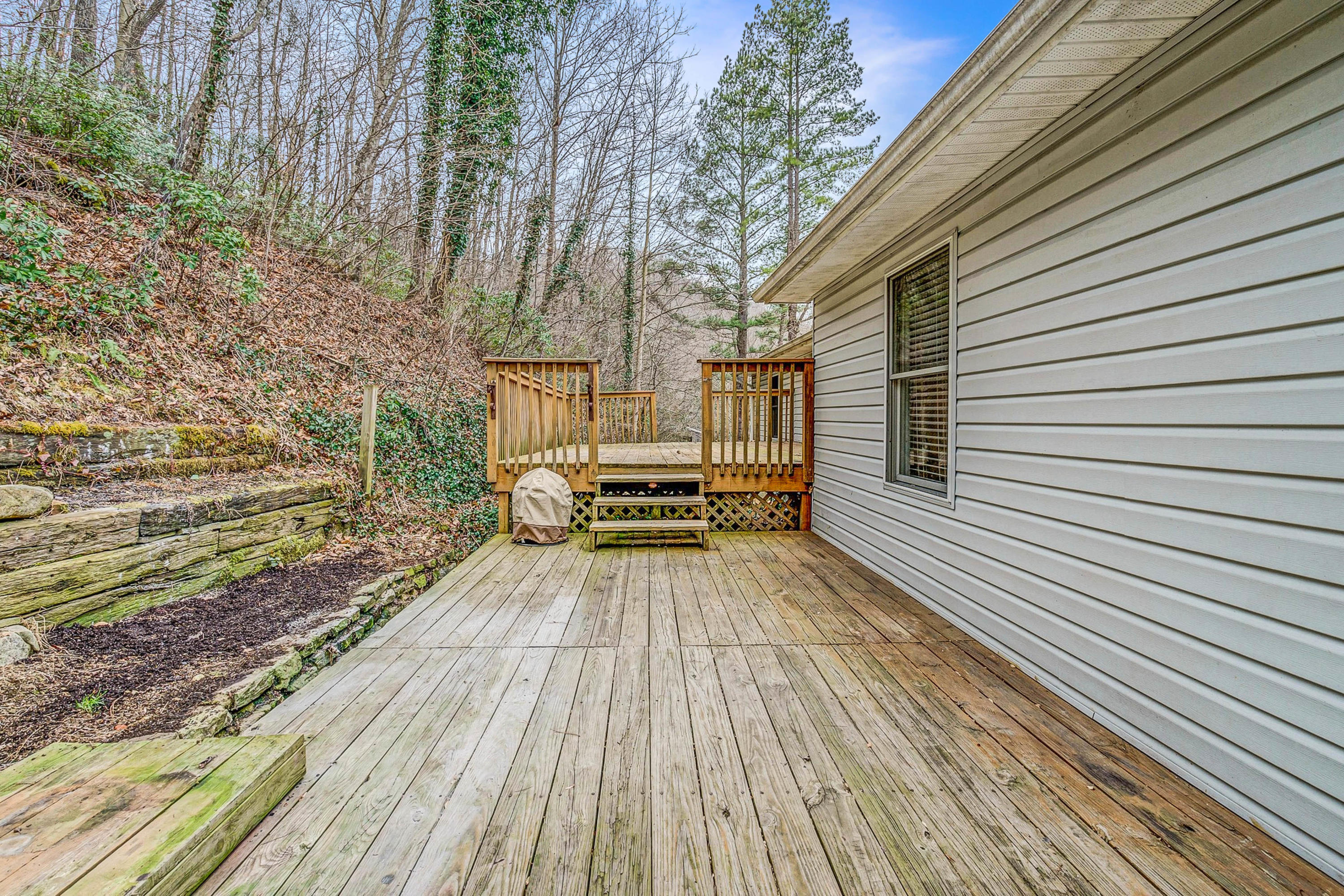 6071 Goodview Road Goodview, VA 24095 - Photo 38 of 44 a view of a wooden deck with a yard