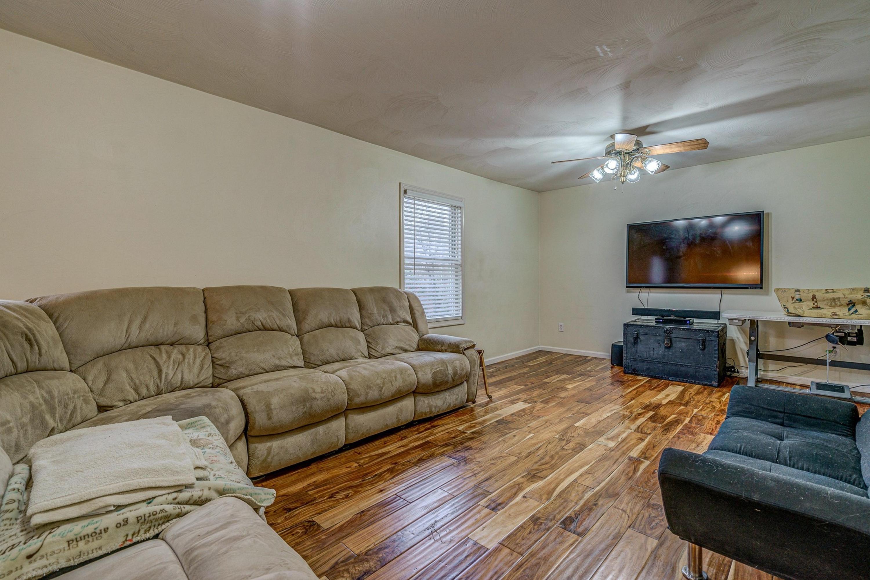 6071 Goodview Road Goodview, VA 24095 - Photo 10 of 44 a living room with furniture and a flat screen tv