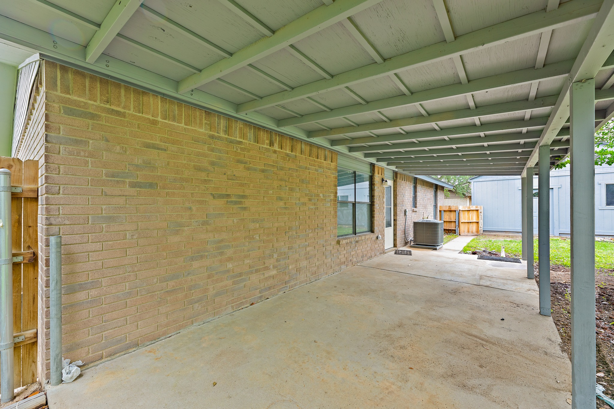 205 Hitching Post Road Kyle, TX 78640 - Photo 4 of 20 A covered front porch adds a welcoming touch and gives you a shaded spot to enjoy the front yard setting.