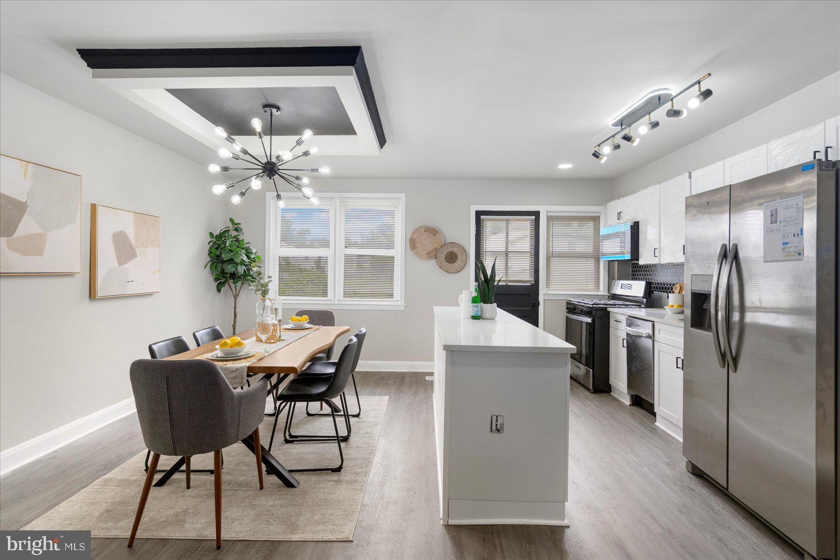 1020 Wicklow Road Baltimore, MD 21229 - Photo 11 of 44 a view of a dining room with furniture and a chandelier