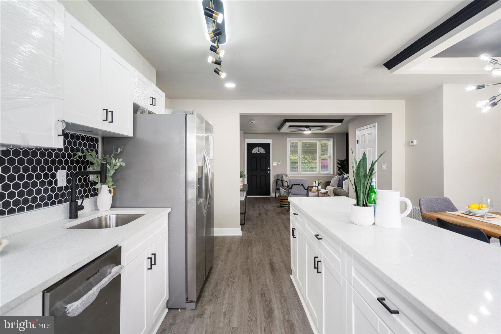1020 Wicklow Road Baltimore, MD 21229 - Photo 13 of 44 a spacious bathroom with a double vanity sink a mirror and a shower
