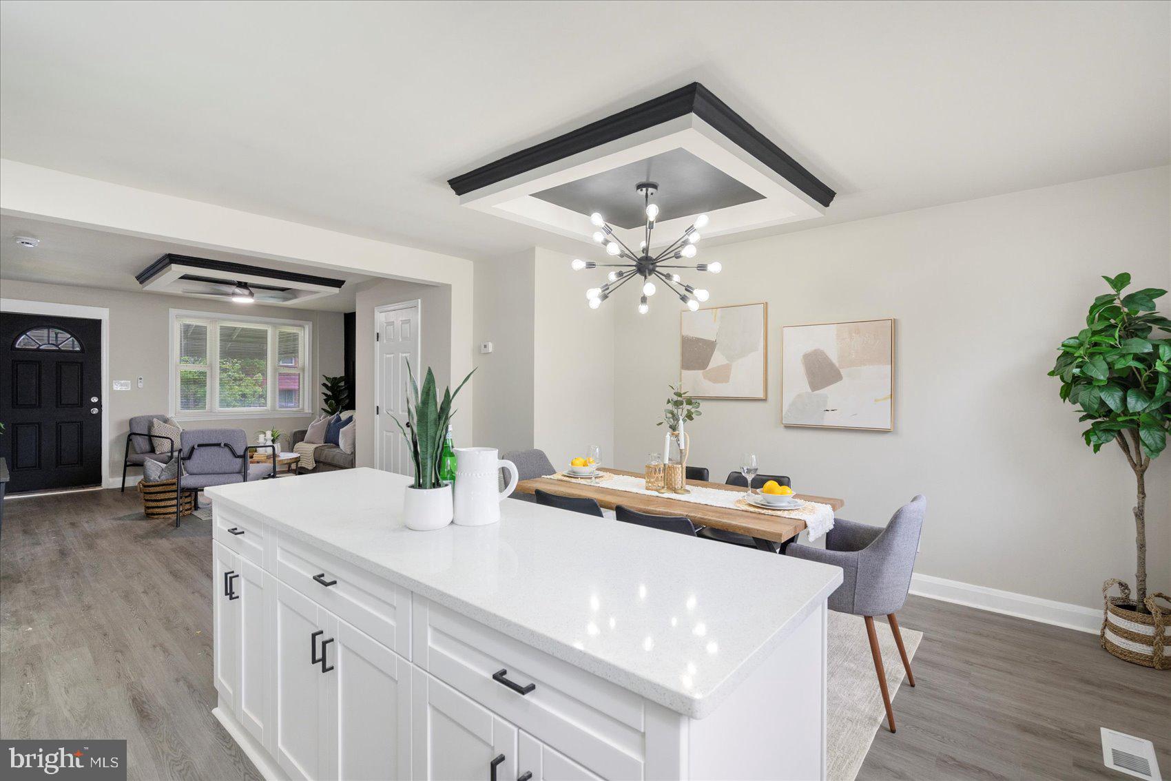 1020 Wicklow Road Baltimore, MD 21229 - Photo 14 of 44 a view of a dining room with furniture and wooden floor
