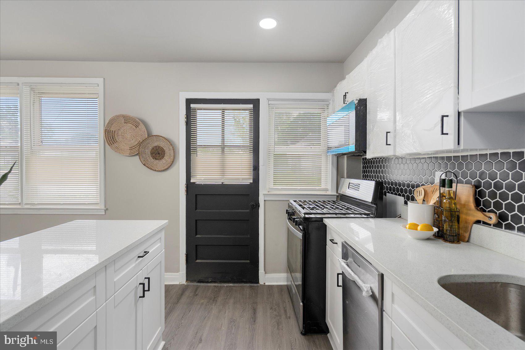 1020 Wicklow Road Baltimore, MD 21229 - Photo 15 of 44 a kitchen with a sink stove and refrigerator
