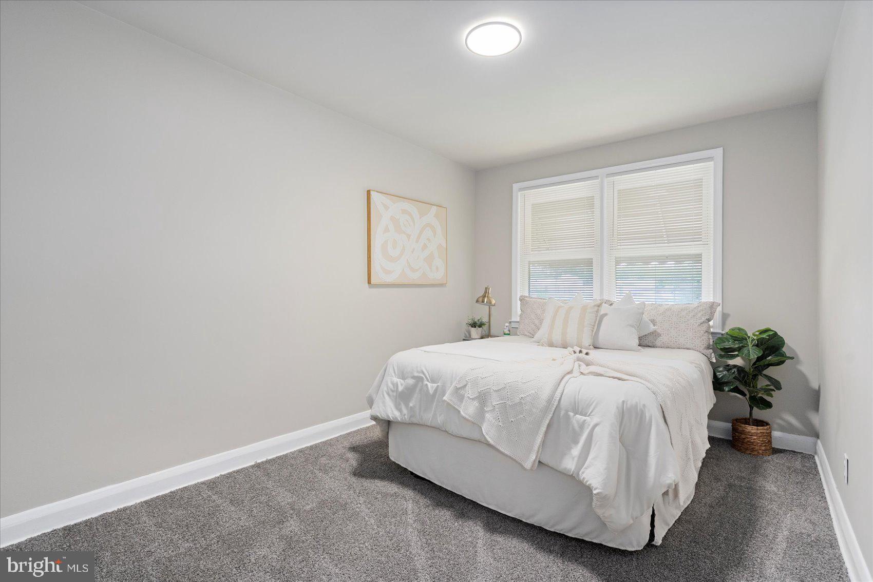 1020 Wicklow Road Baltimore, MD 21229 - Photo 20 of 44 a bedroom with a bed and a window