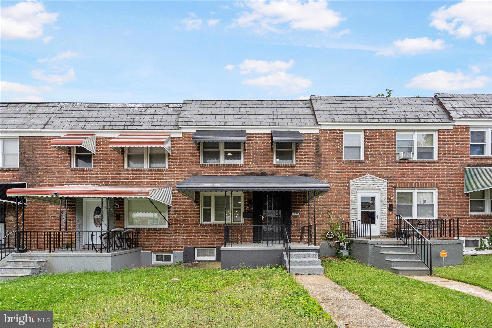 1020 Wicklow Road Baltimore, MD 21229 - Photo 2 of 44 front view of a brick house with a yard