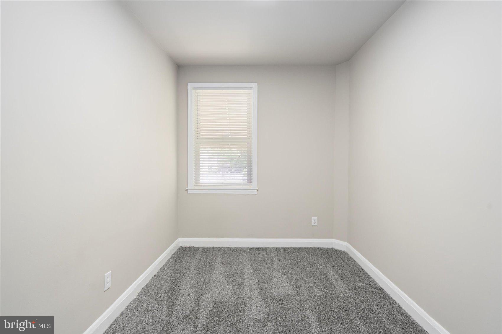 1020 Wicklow Road Baltimore, MD 21229 - Photo 23 of 44 a view of a small space with wooden floor and a window