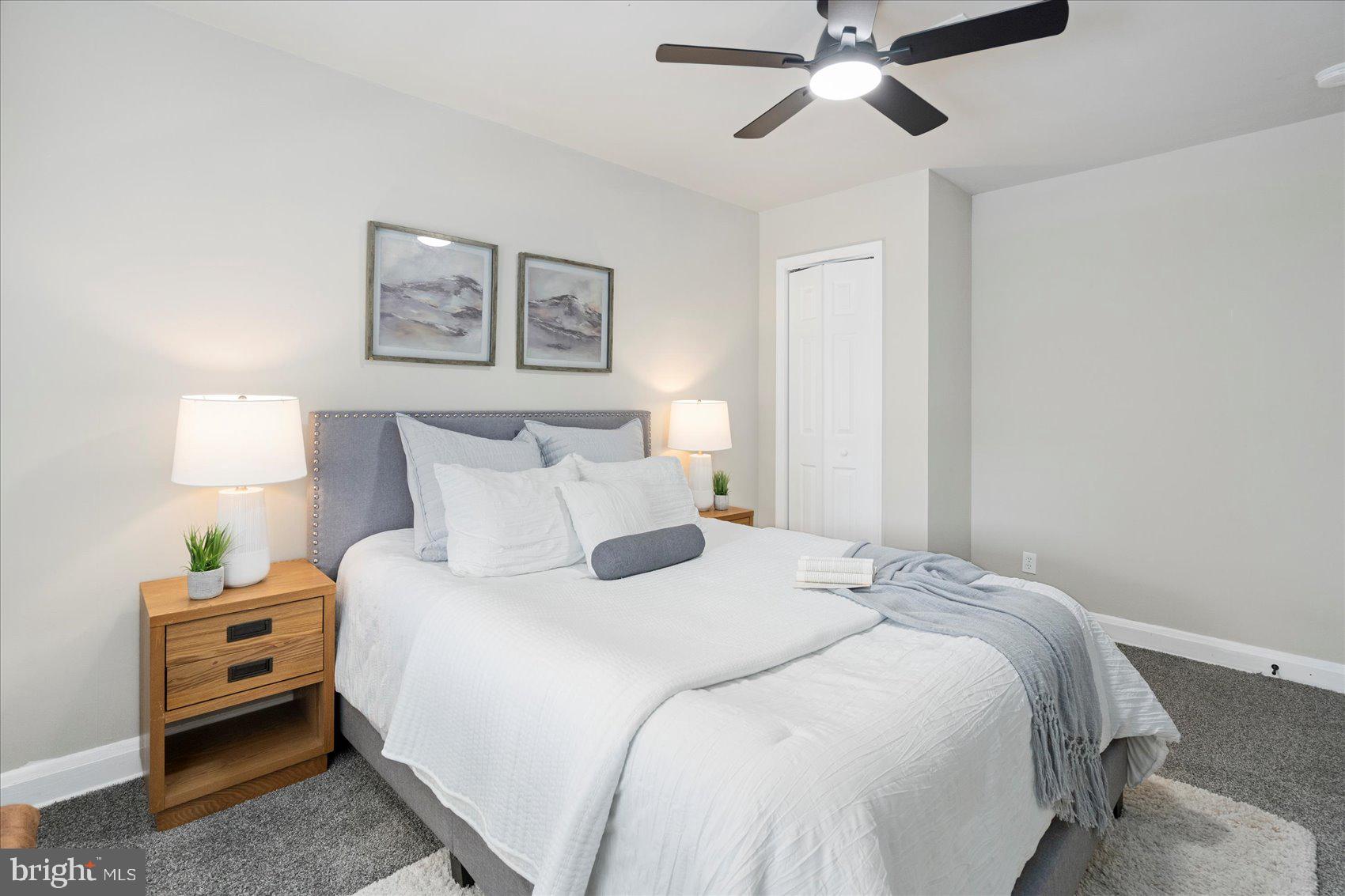 1020 Wicklow Road Baltimore, MD 21229 - Photo 26 of 44 a bedroom with bed and a chandelier