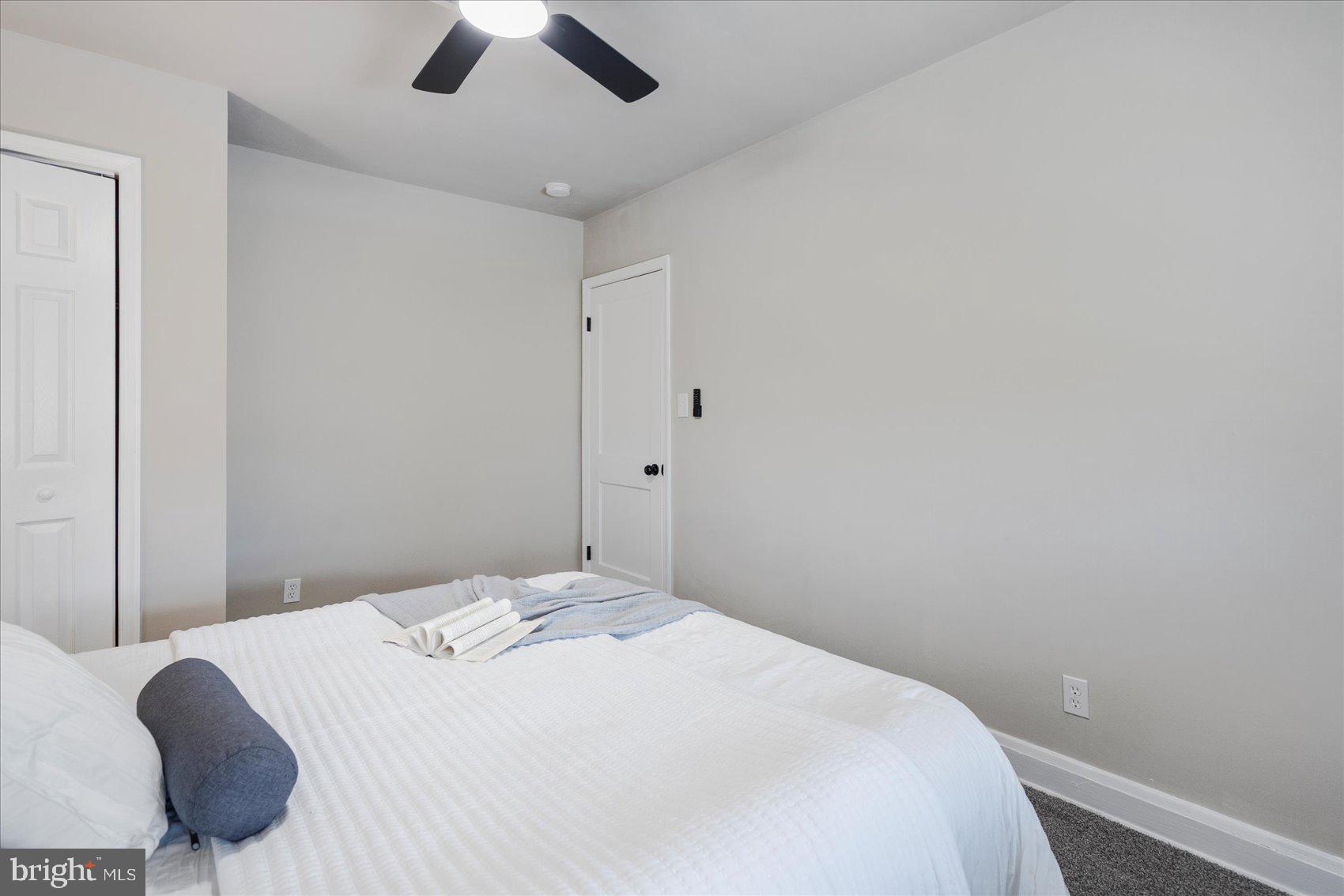 1020 Wicklow Road Baltimore, MD 21229 - Photo 27 of 44 a bedroom with a bed and a ceiling fan