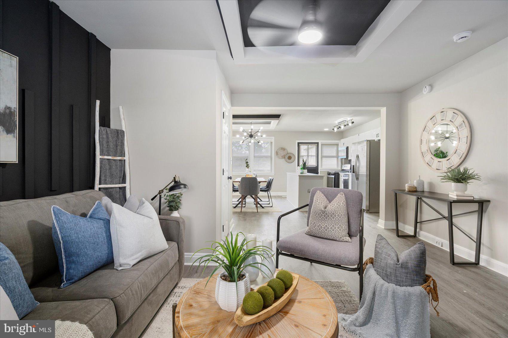 1020 Wicklow Road Baltimore, MD 21229 - Photo 3 of 44 a living room with furniture and a clock