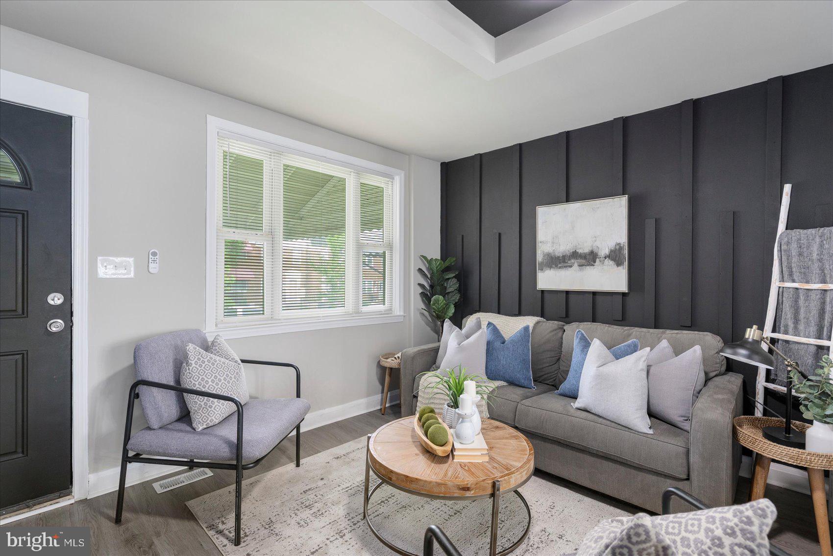 1020 Wicklow Road Baltimore, MD 21229 - Photo 4 of 44 a living room with furniture and a large window