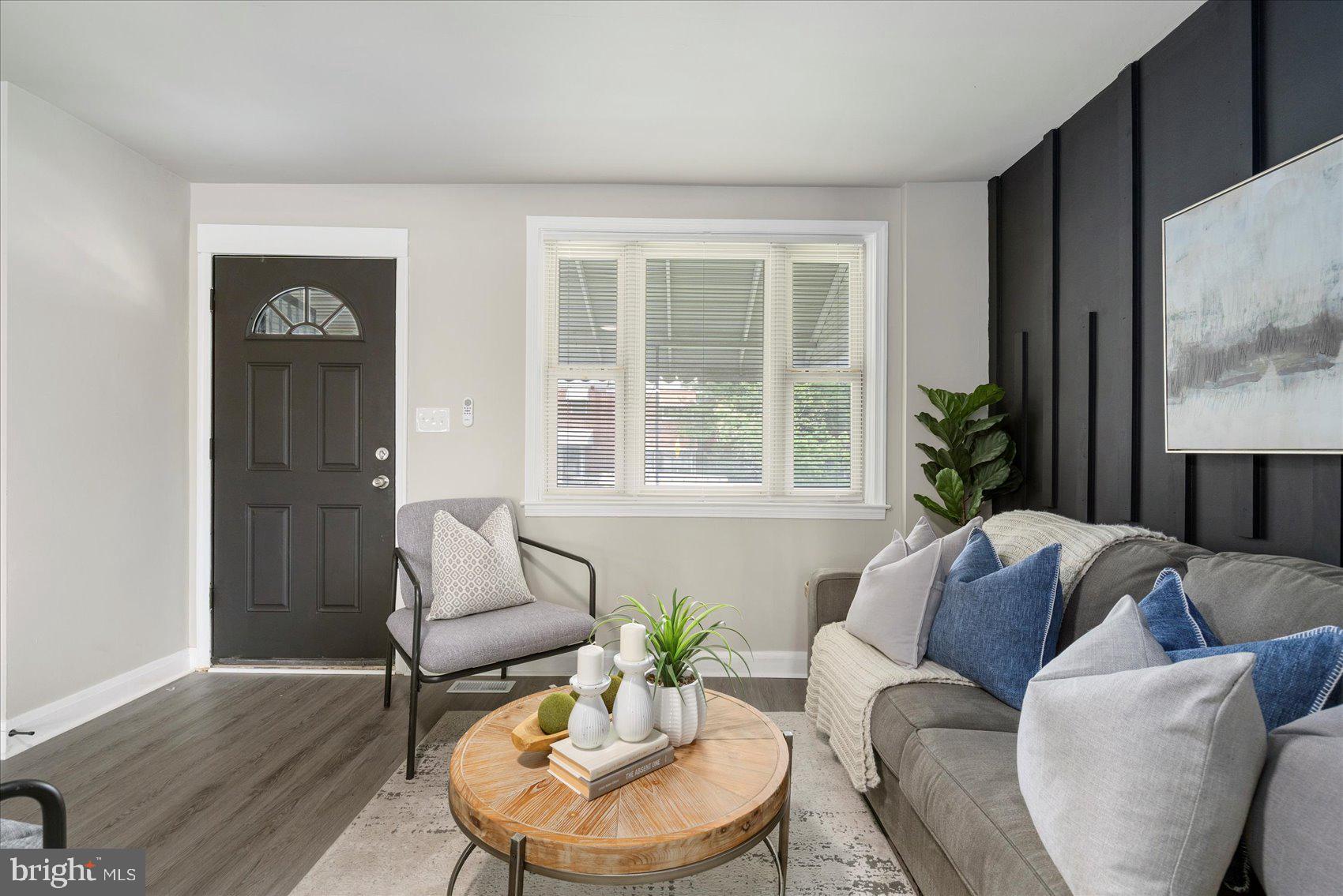 1020 Wicklow Road Baltimore, MD 21229 - Photo 5 of 44 a living room with furniture and a large window