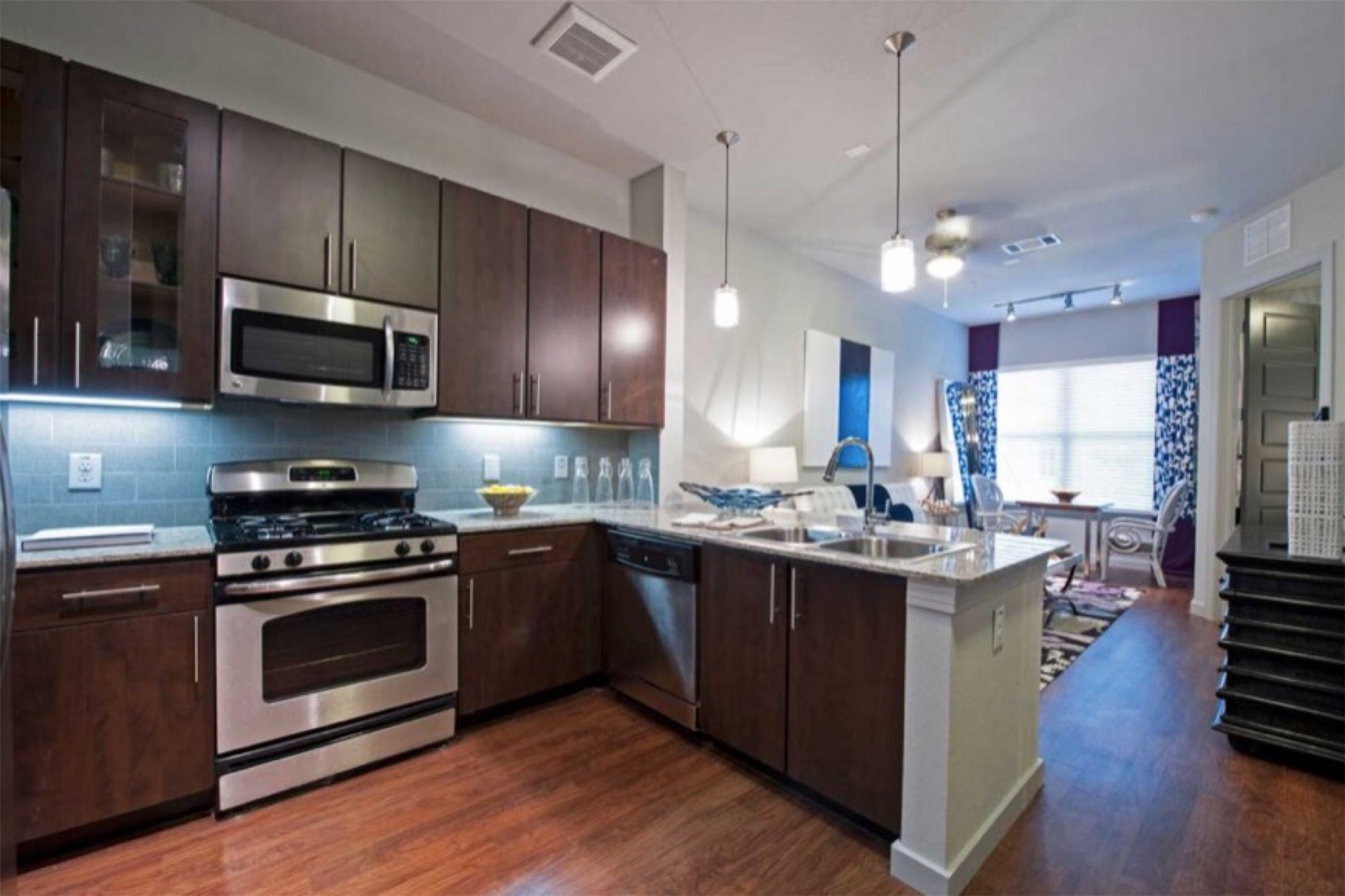 a kitchen with a stove and a microwave oven
