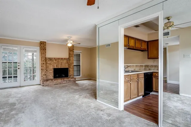 a view of a kitchen with furniture and a fireplace