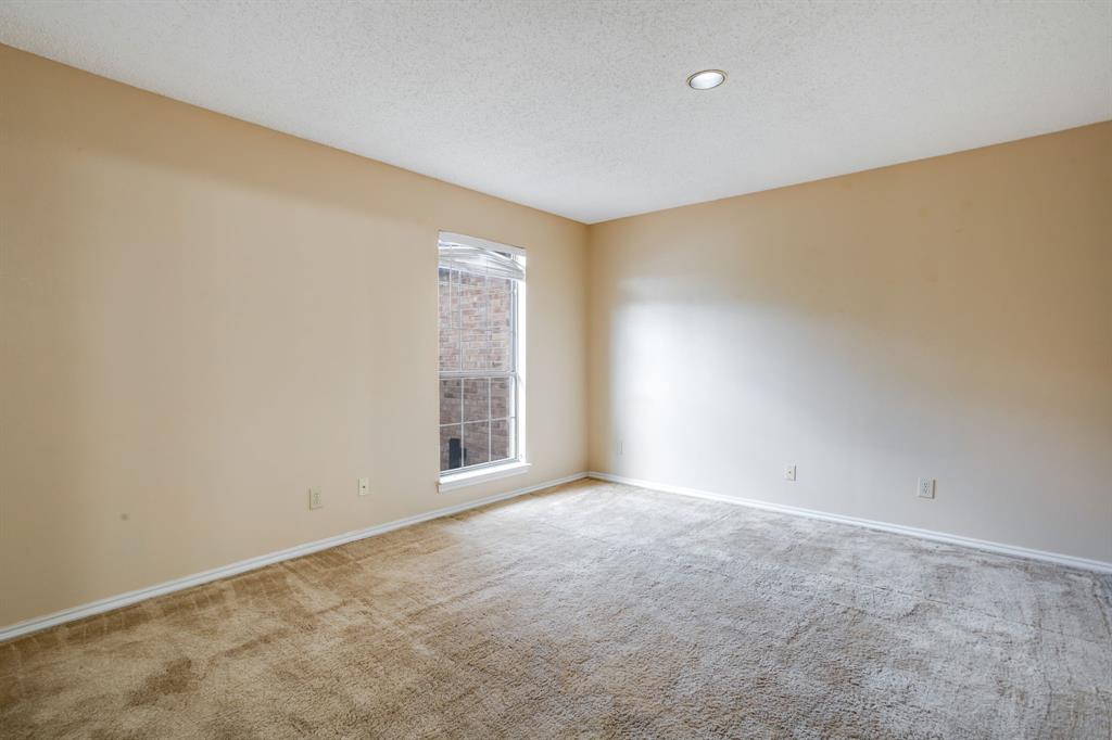 16301 Ledgemont Lane, Unit 267 Addison, TX 75001 - Photo 15 of 25 an empty room with windows