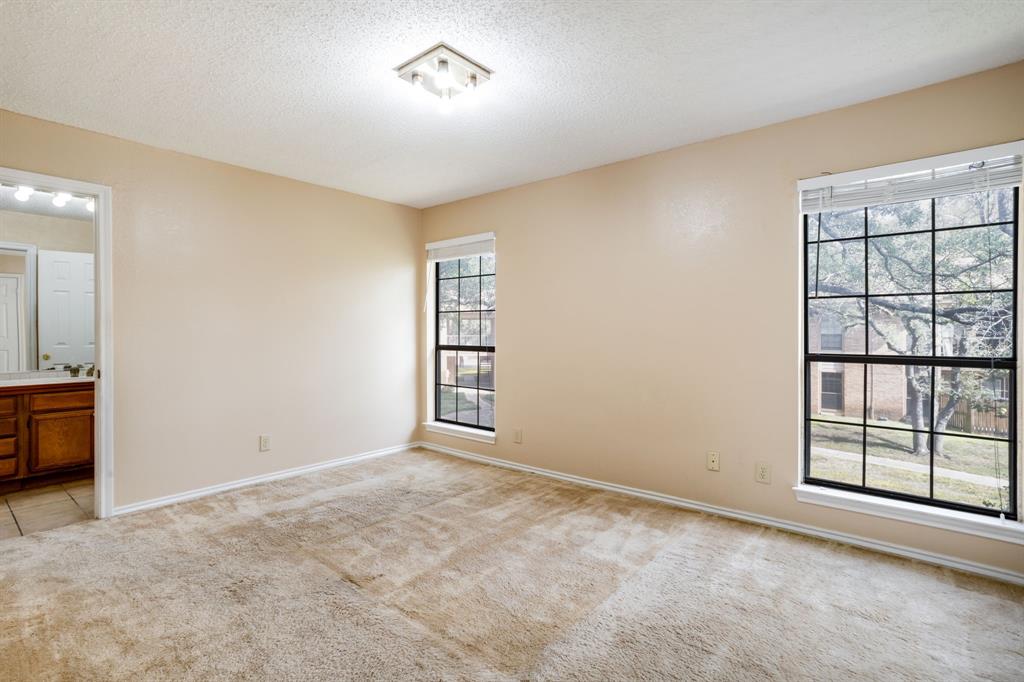 16301 Ledgemont Lane, Unit 267 Addison, TX 75001 - Photo 17 of 25 an empty room with windows