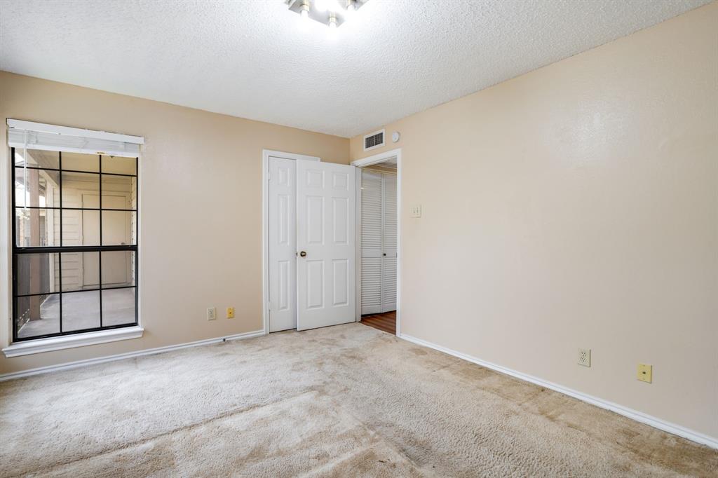 16301 Ledgemont Lane, Unit 267 Addison, TX 75001 - Photo 18 of 25 a view of an empty room