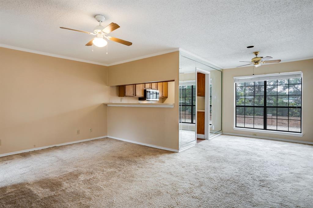 16301 Ledgemont Lane, Unit 267 Addison, TX 75001 - Photo 8 of 25 a view of an empty room with a window
