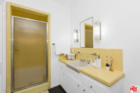 a bathroom with a sink and a mirror