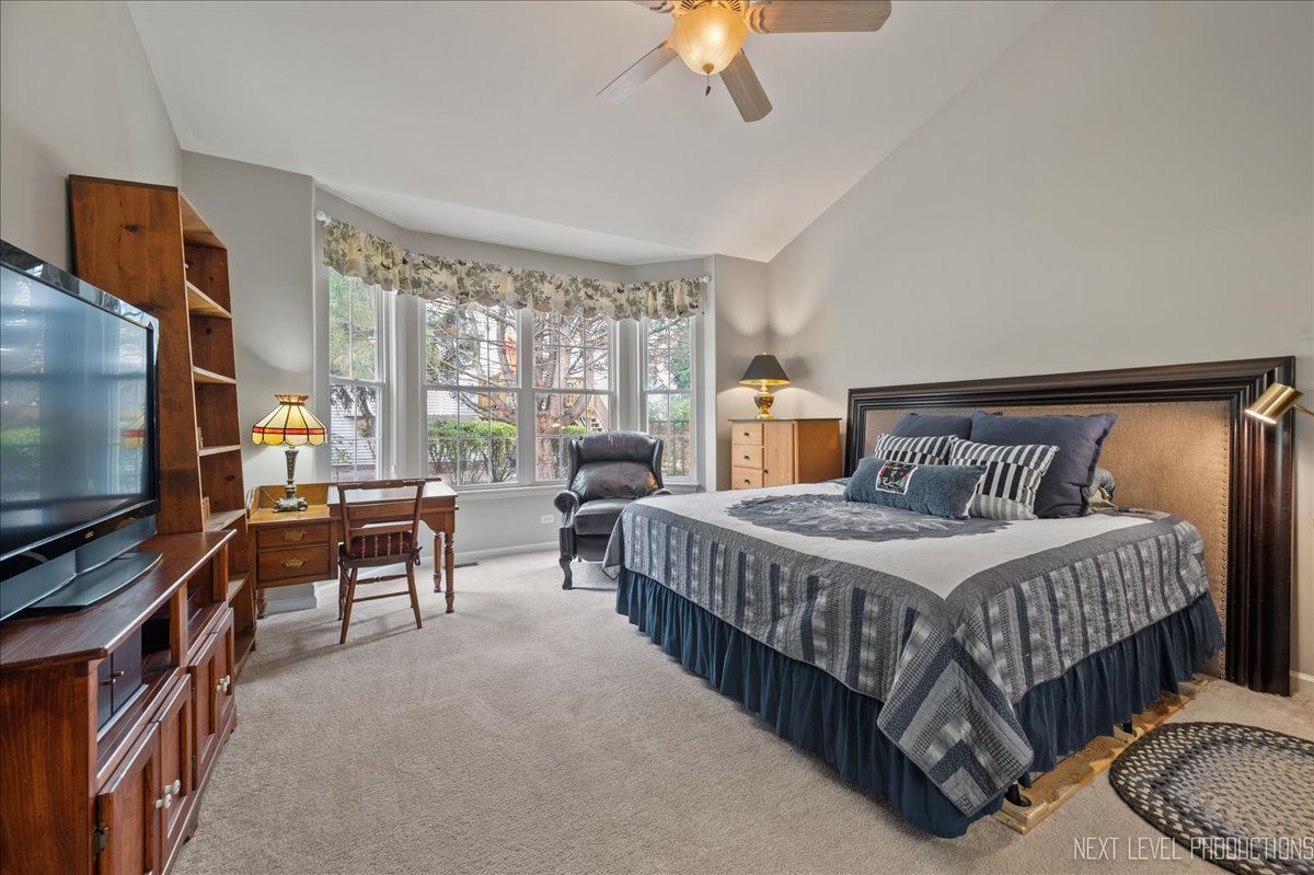 332 Wolcott Lane Batavia, IL 60510 - Photo 14 of 28 a bedroom with a bed and a flat screen tv