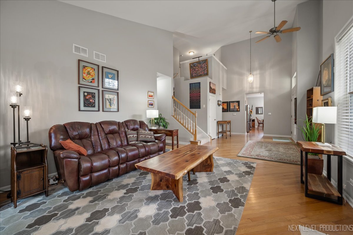 332 Wolcott Lane Batavia, IL 60510 - Photo 7 of 28 a living room with furniture and wooden floor