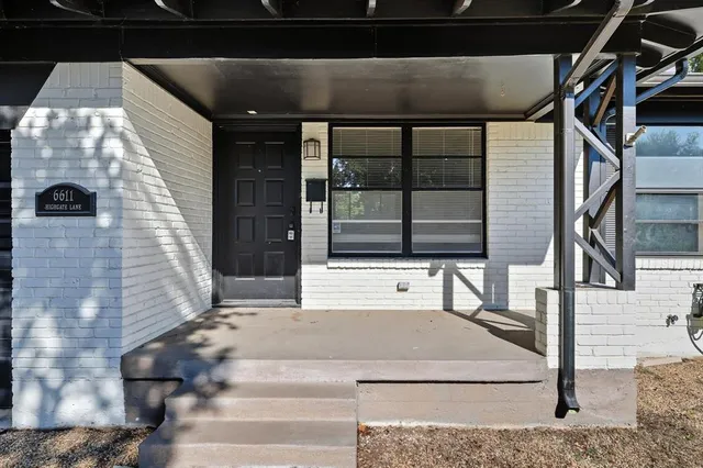 a kitchen with a stove a sink and a microwave