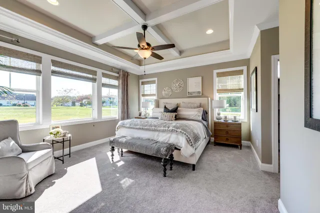 a bedroom with a bed couch and window