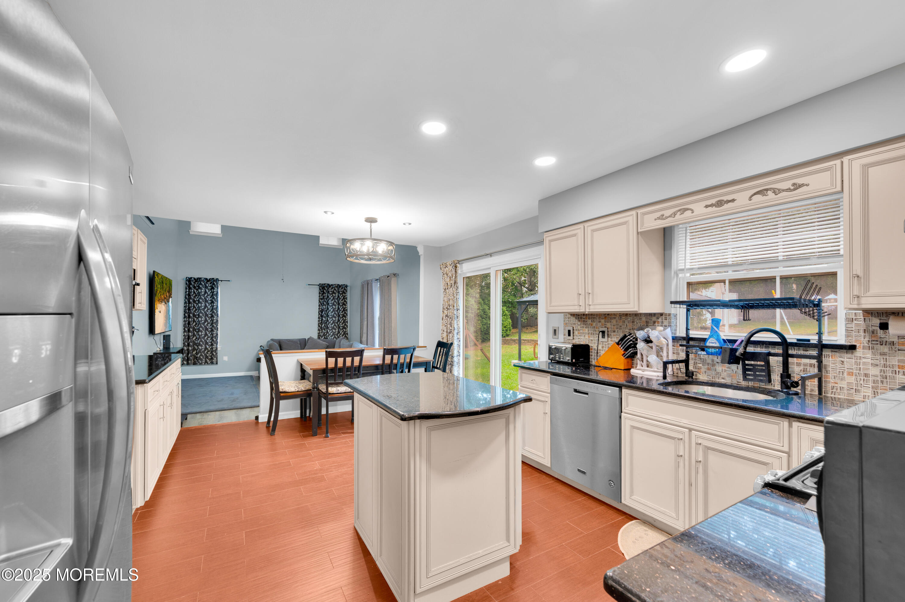 76 Diamond Lane Howell, NJ 07731 - Photo 14 of 36 a kitchen with stainless steel appliances granite countertop sink stove top oven and cabinets