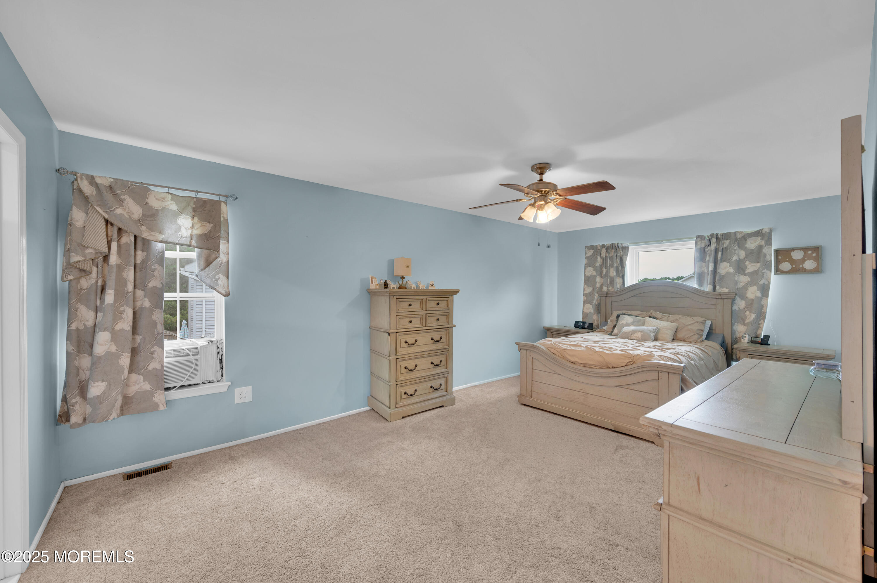 76 Diamond Lane Howell, NJ 07731 - Photo 18 of 36 a living room with furniture and a chandelier