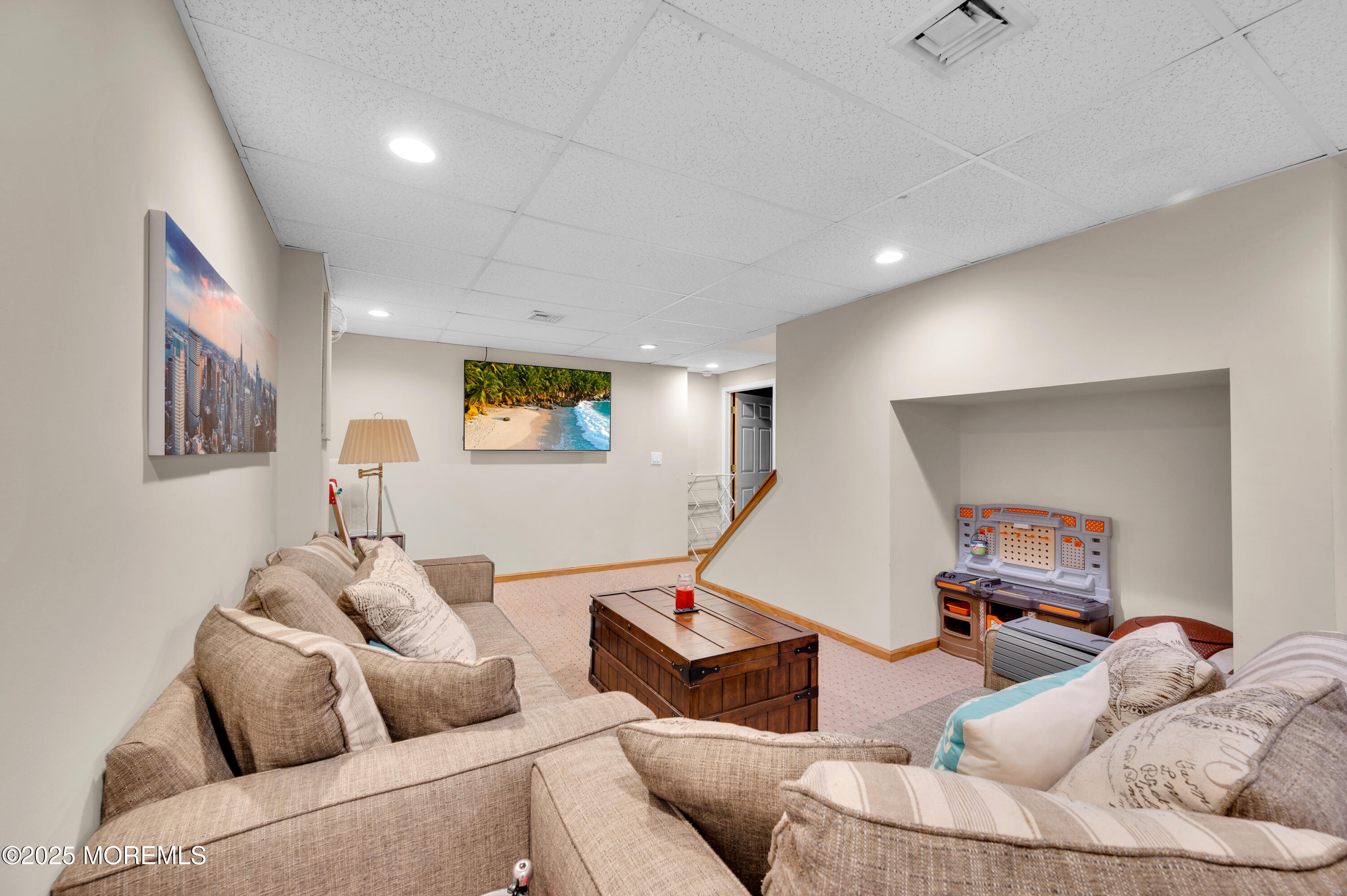 76 Diamond Lane Howell, NJ 07731 - Photo 25 of 36 a living room with furniture and a wooden floor
