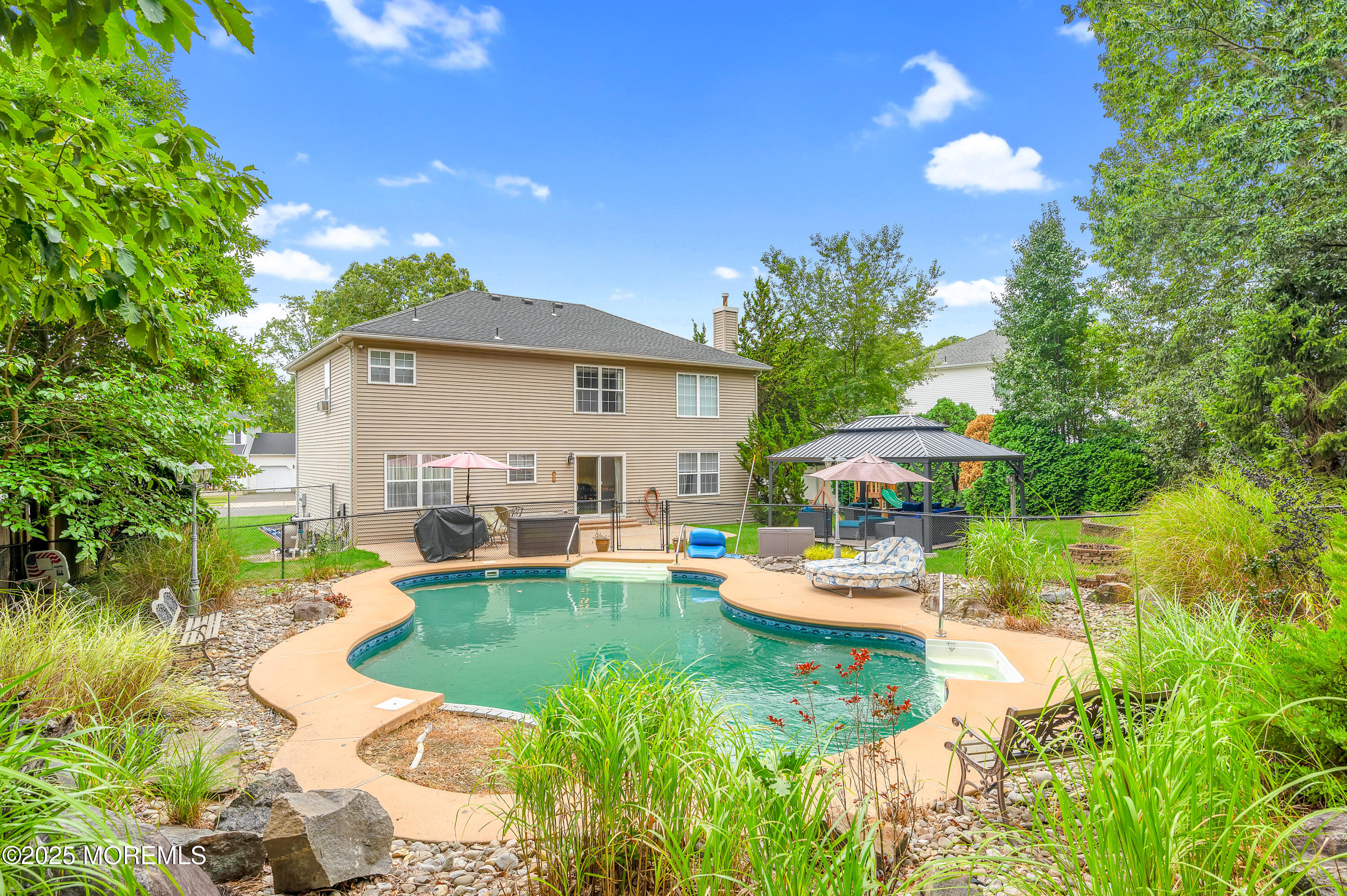 76 Diamond Lane Howell, NJ 07731 - Photo 29 of 36 a view of a house with backyard sitting area and garden