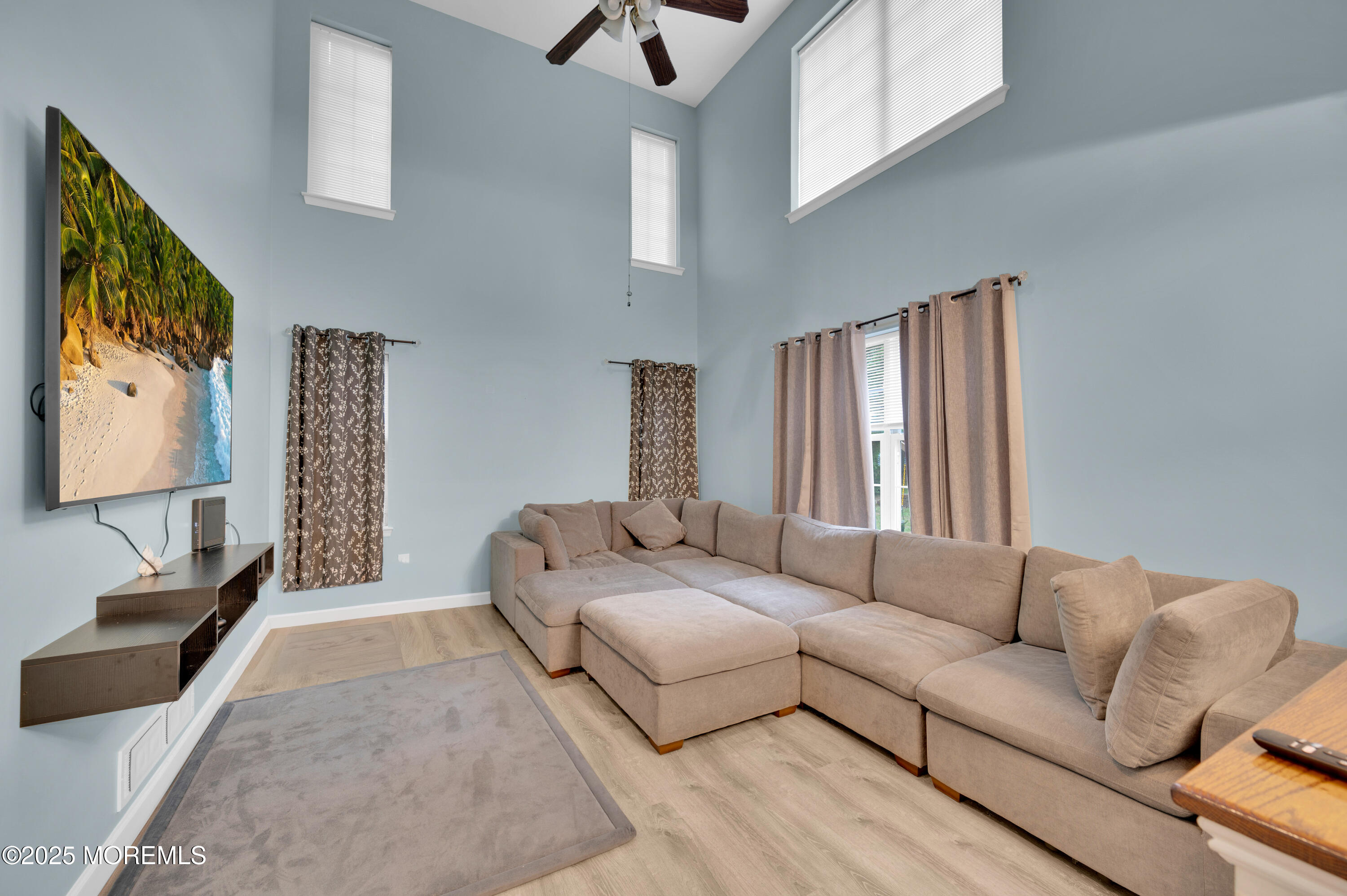 76 Diamond Lane Howell, NJ 07731 - Photo 10 of 36 a living room with furniture and a flat screen tv