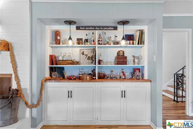 a bedroom with furniture and a chandelier