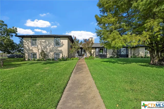 a view of a house with a big yard