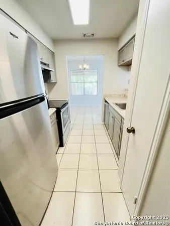 a view of washer and dryer with wooden floor