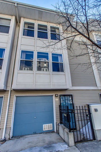 1007 East 61st Street Chicago, IL 60637 - Photo 1 of 20 a building with glass windows